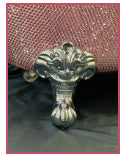 Tiny bathtub close up of metal foot