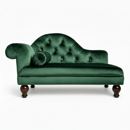 Green velvet chaise lounge with tufted backrest on a white background