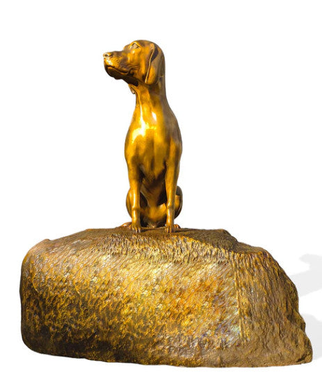 Bronze statue of a dog on a white background