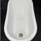 White ceramic small bathtub on a black background