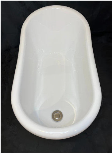 White ceramic small bathtub on a black background