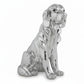 Silver dog figurine on a white background