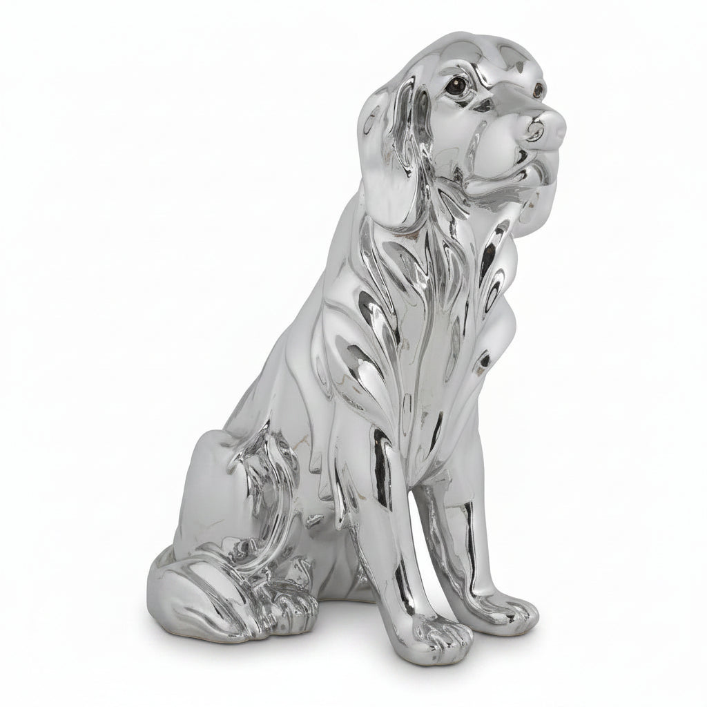 Silver dog figurine on a white background