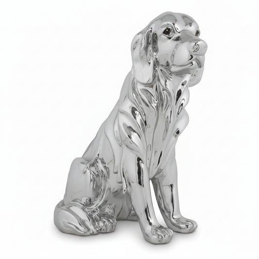 Silver dog figurine on a white background