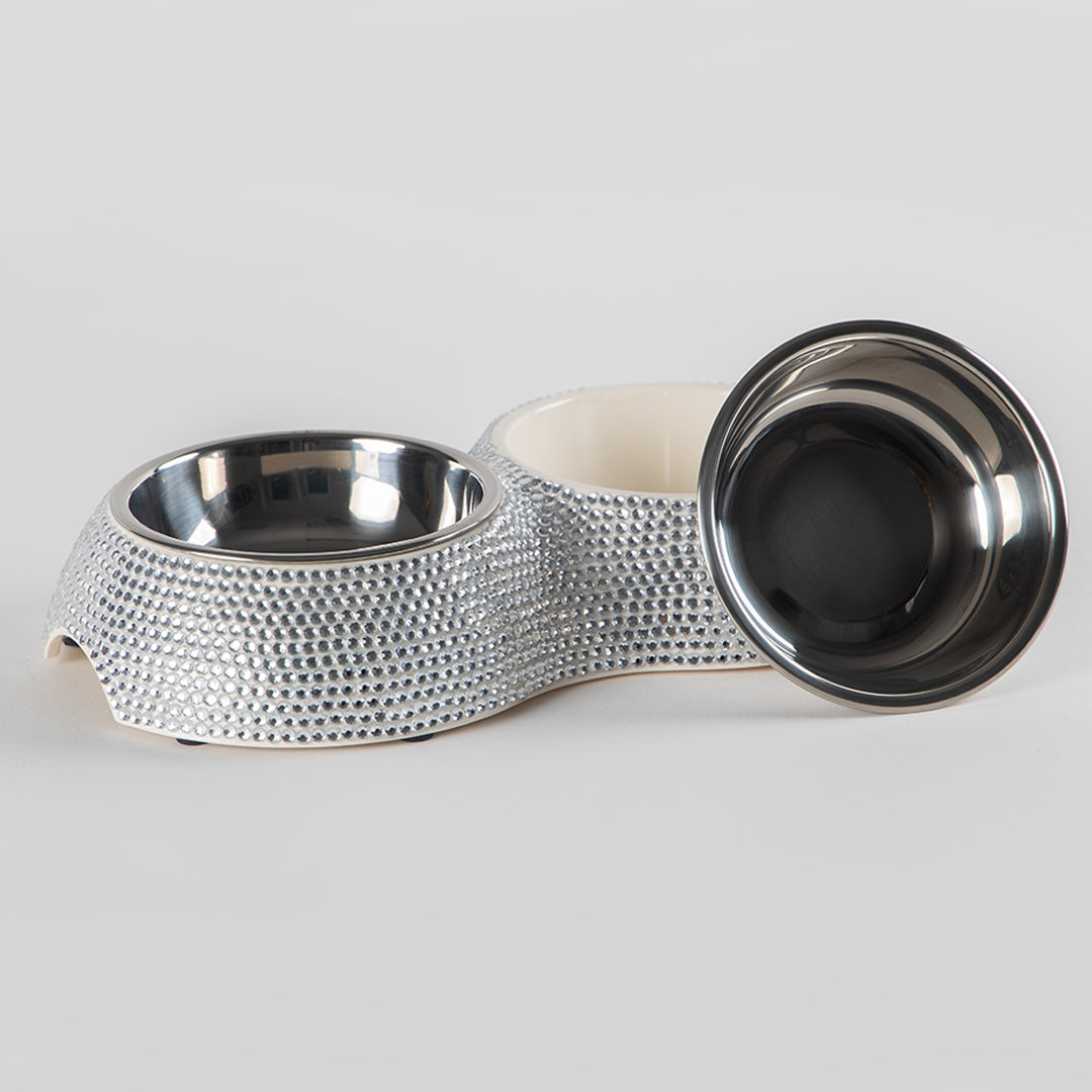 Pet bowl with textured metallic base on a light gray background