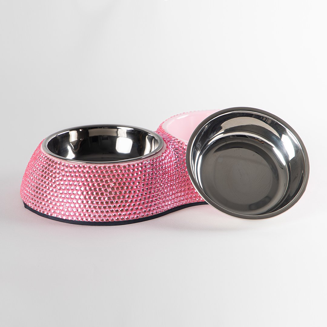Pink blinged-out pet bowl with a silver interior on a white background